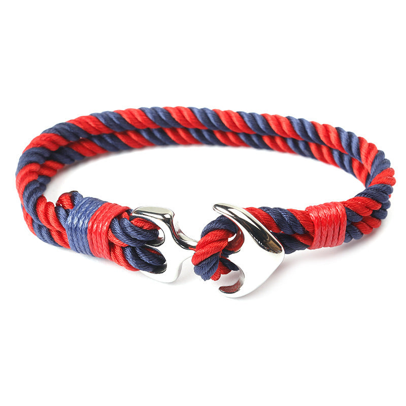 Close-up of zinc anchor detail on braided marine rope bracelet.
