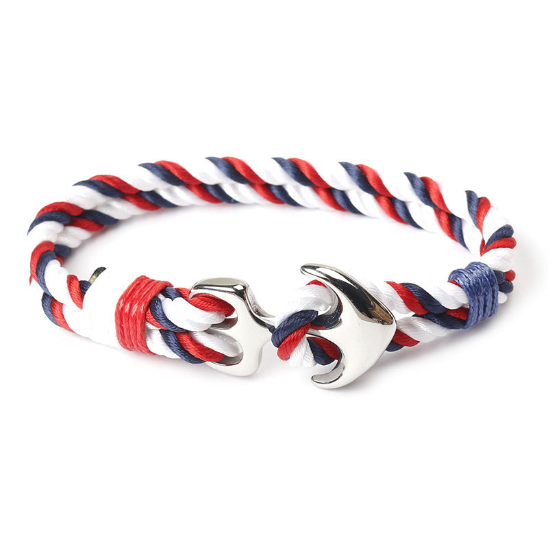 Close-up of zinc anchor detail on braided marine rope bracelet.