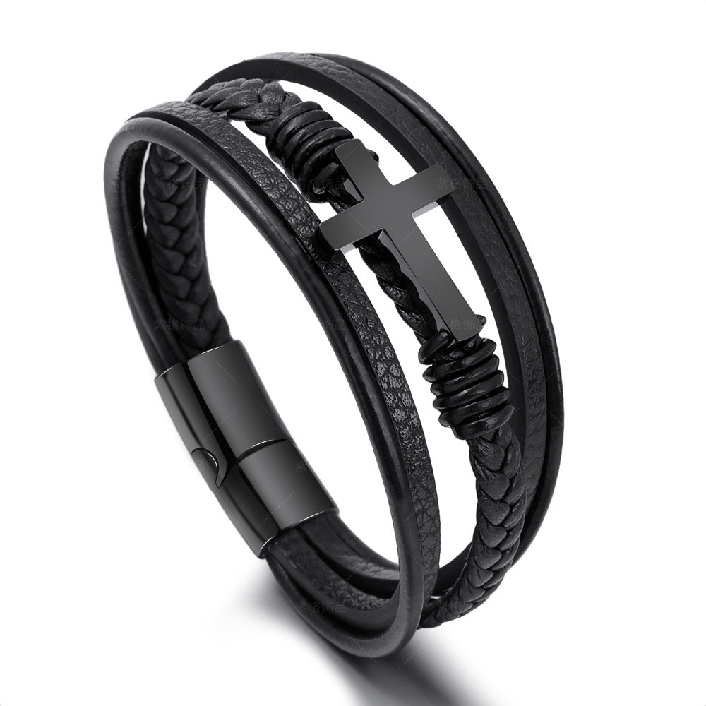 Solid steel cross bracelet with matte black finish on rugged leather.