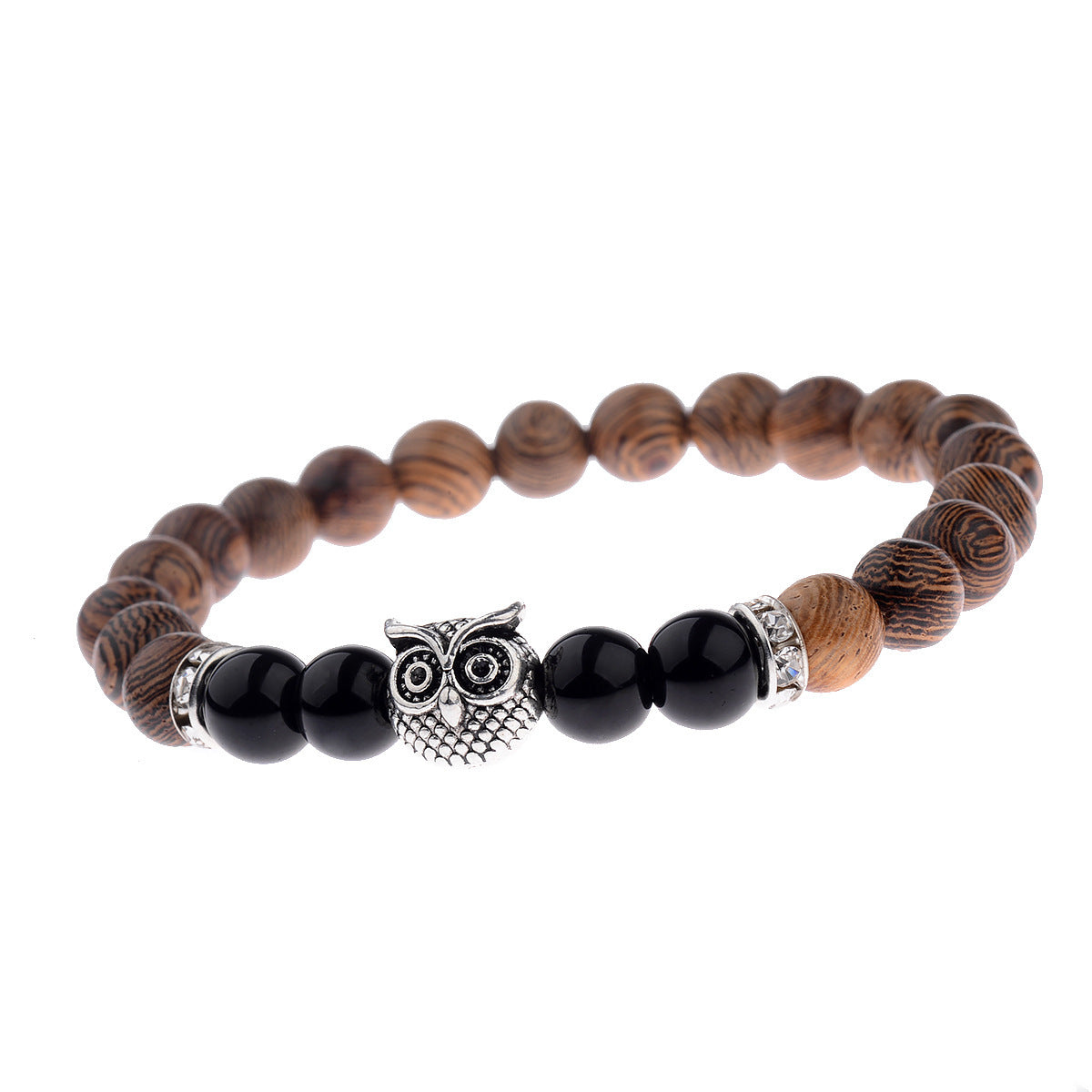Close-up of owl-engraved frosted stone beads on wood grain bracelet.