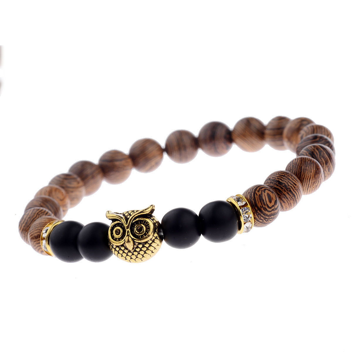 Close-up of owl-engraved frosted stone beads on wood grain bracelet.