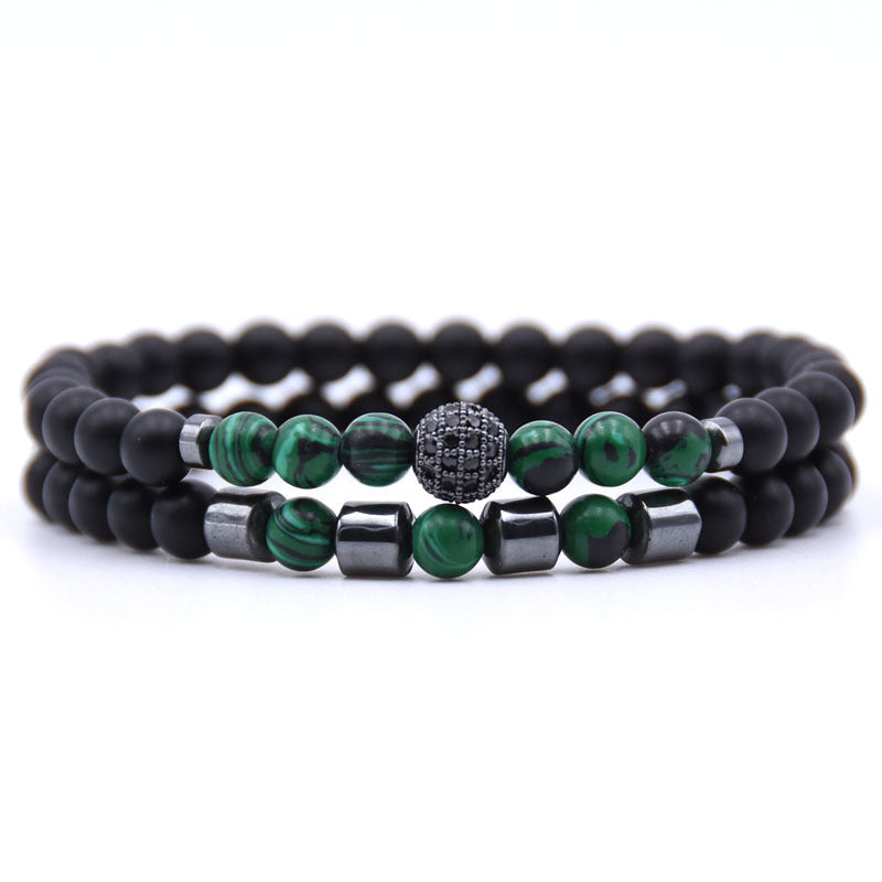 Close-up of 6mm natural stone beads with micro-zircon rune patterns.