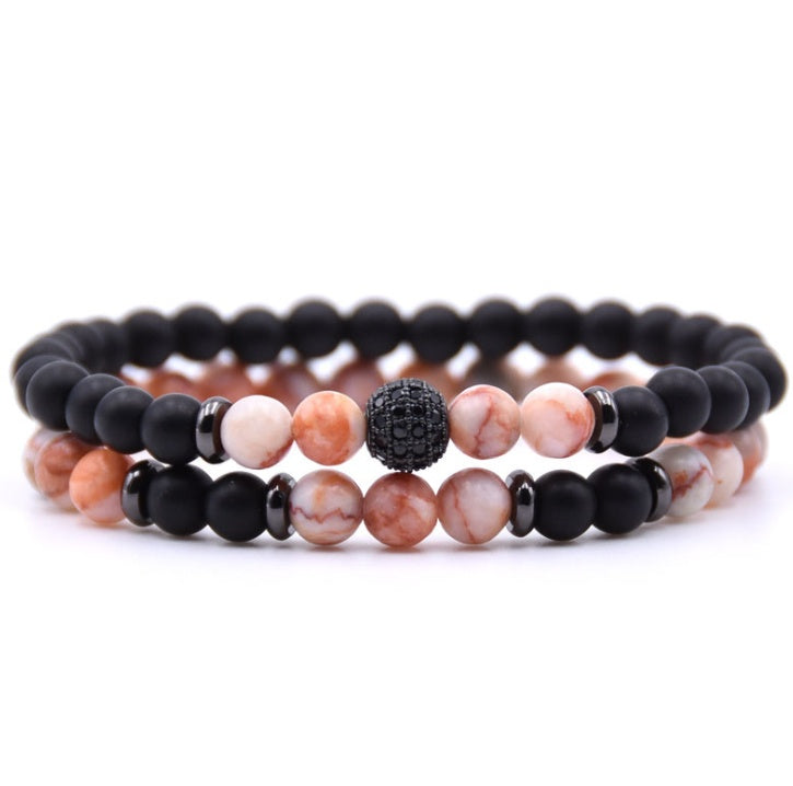 Close-up of 6mm natural stone beads with micro-zircon rune patterns.