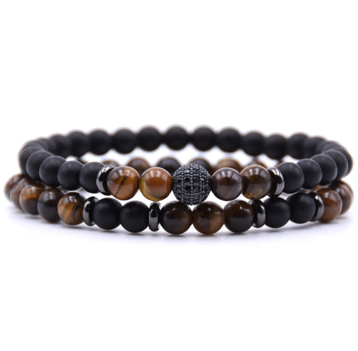 Close-up of 6mm natural stone beads with micro-zircon rune patterns.