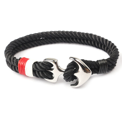 Close-up of zinc anchor detail on braided marine rope bracelet.