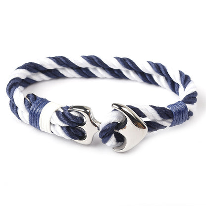 Close-up of zinc anchor detail on braided marine rope bracelet.
