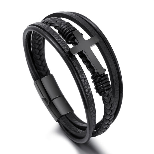Solid steel cross bracelet with matte black finish on rugged leather.